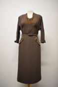 A beautifully tailored 1940s day dress, having velvet insert to bodice and velvet faux pocket,