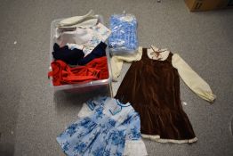 A box full of children's mixed vintage clothing, predominantly 1970s, various styles and ages.