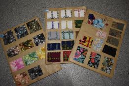Three scrap books of vintage fabrics samples, mostly mid century including some lovely hand