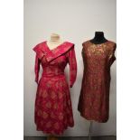 A late 1950s cerise pink and gold brocade dress with huge statement collar and a similar coloured