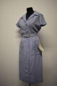 A 1950s cornflower blue linen Peter Barron day dress, having button fastening to bodice and short