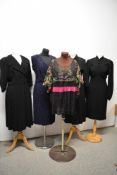 A collection of vintage 1940s-50s dresses, including navy blue beaded dress,AF, some fade to