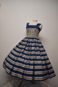 An incredible 1950s Horrockses cotton day dress, having cobalt blue ground with yellow,blue,pink,