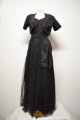 A decadent Art Deco 1930s evening gown with matching bolero and sash belt, fashioned from black