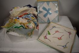 A collection of vintage antique handkerchiefs and several pairs of gloves, including some in