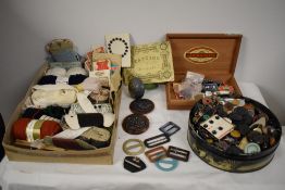 A good collection of vintage and antique haberdashery, including buckles, buttons, threads,