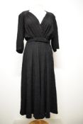 A 1940s textured crepe day dress, having 3/4 sleeves, low cut bodice, belt to waist and fairly