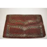 A 1771 dated oxblood couloured leather Ottoman wallet, with white metal embroidery and '