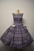 A stunning Linzi Line cotton day dress, Having bright royal purple geometric/ snowflake like