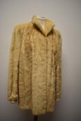 A 1980s blonde mink jacket, having pockets to front and fitted cuffs, soft and supple condition,