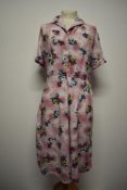 A 1940s floral cotton day dress, having button down front and side press stud fastening, large
