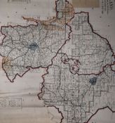 A folder containing vintage Ordnance Survey maps and plans
