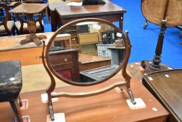 An early 20th Century oval toilet mirror