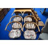 A set of six Ercol comb back style armchairs