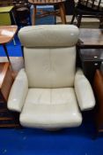A modern cream leather Stressless recliner armchair