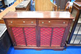 A handmade mahogany sideboard in the Regency style, having musical instrument inlay and brass