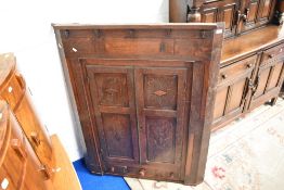 A period oak corner cupboard of large proportions