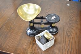 A traditional kitchen scales labelled The Viking with brass dish and selection of weights