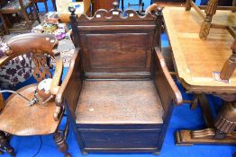 A period oak box chair of throne style design