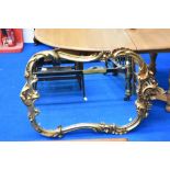 A large gilt frame wall mirror of scroll and foliate design