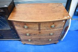 A 19th Century mahogany bow front chest of two over two drawers having Regency brass handles