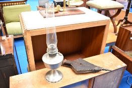 A vintage oil lamp and pair of bellows
