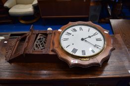 A traditional mahogany cased wall clock