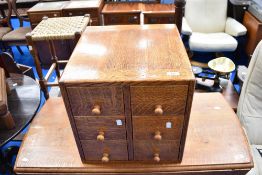 A vintage golden oak index chest of six small drawers, approx 41 x 41 x 44cm