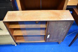 A sapele bookcase with cupboard to side