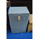A vintage Lloyd loom linen basket of tall proportions