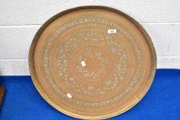 A brass table top of Eastern design