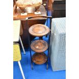 An early 20th Century oak cake stand