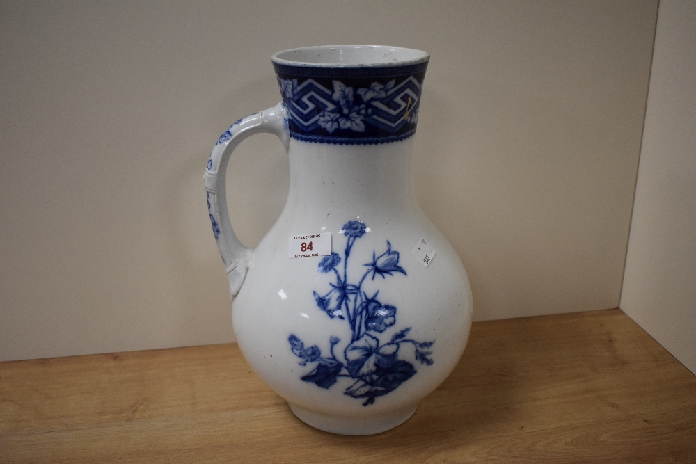 A late 19th century vase, having blue and white floral transfer pattern marked to underside with