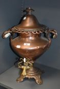 A 19th century copper samover, having opaque glass to handles and brass tap.