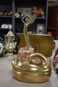 A polished brass lidded bowl of egg basket in the of a swan and a 20th century brass figurine on