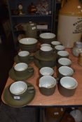 A selection of Denby table ware, bowls, cups and saucers, milk jug and coffee pot amongst this lot.