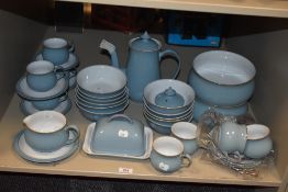 A selection of Denby in pale blue colourway, comprising tea pot, bowls, cups and saucers, butter