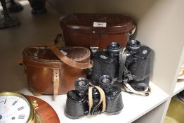 A pair of vintage Carl Zeiss Jena Jenoptem binoculars and a pair of Delacroix Paris binoculars, both