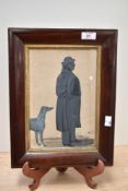 A framed and glazed Victorian gouache silhouette of a gentleman and his Greyhound.