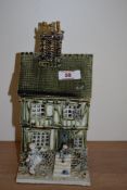 A Studio pottery ornamental house with children playing to front, Dennis Taplin gallery, Woodbridge,