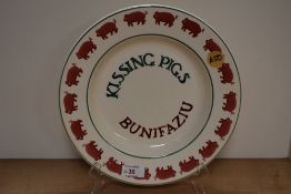 An Emma Bridgwater plate, having pig border over the words Kissing pigs.