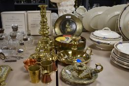 A mixed lot of brass, including candlesticks, ashtray and pin dish and a vintage tin of