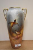 An early 20th century vase, having Worcester styling, with hand painted Pheasant and woodland scene,