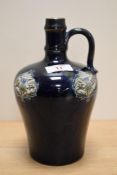 An Art Noveau bottle vase, having dark blue ground with thistle decoration, marked to underside