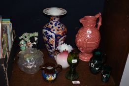 An assortment of vintage glassware and ceramics, including green glass jug and beaker with enamelled