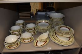 A collection of Midwinter tableware having white ground with cream and burgundy bands with gilt