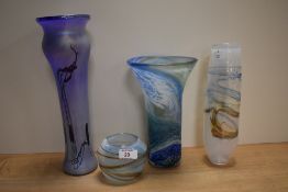 Four pieces of art glass, including iridescent vase and mottled white vase with lustre design.
