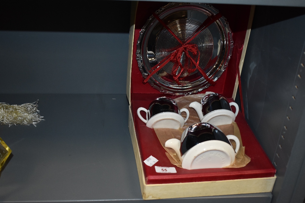 A 'Celtic quality plate' teapot, sugar and creamer set, with plate, in original box.