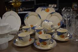 A collection of 1930s Corona ware ' Langtrey' cups, saucers, jug, side plates and cake plate, having