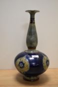 An Art Nouveau Royal Doulton vase, of baluster form with elongated neck, having grey and blue ground